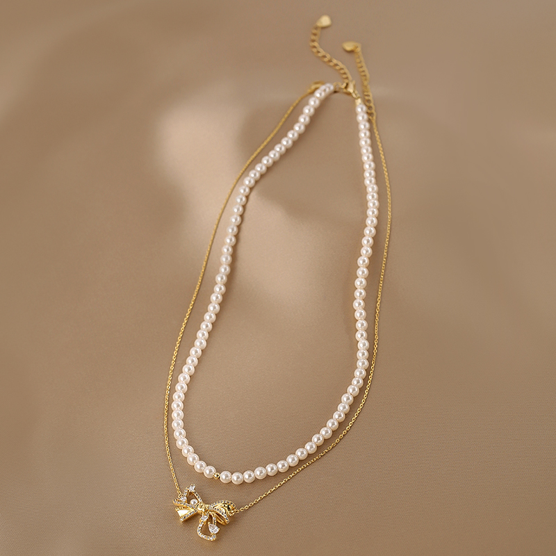 Trendy Double-Layer Bow Pendant Pearl Necklace for Women - Elegant Niche Design Clavicle Chain 2025